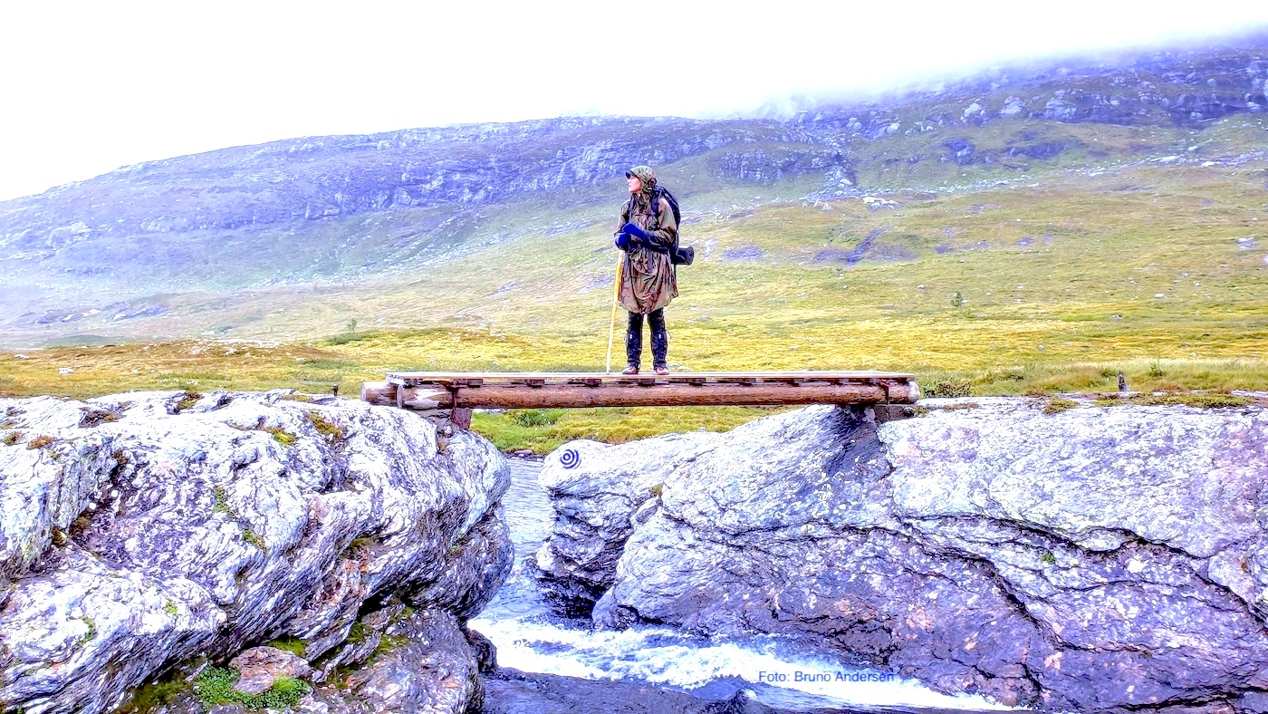 Me standing on a bridge above a river in Breheimen, Norway