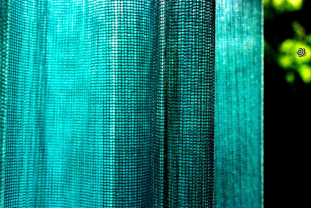 Close-up of turquoise netted fabric